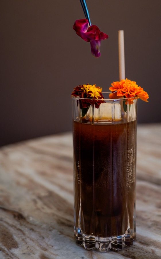 Cascara Fizz, a spirit-free cocktail of black rose, coffee-soaked verjus, coconut palm syrup and plum on the Vendador fall and winter cocktail menu