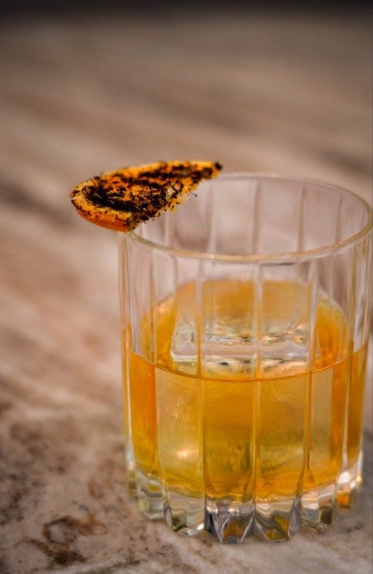 El Camino, a cocktail of mezcal, tequila, aperitif, blood orange and allium ash on the Vendador fall and winter cocktail menu