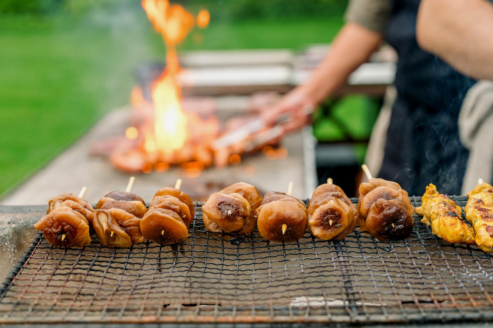 Mushroom skewers on the grill over live fire