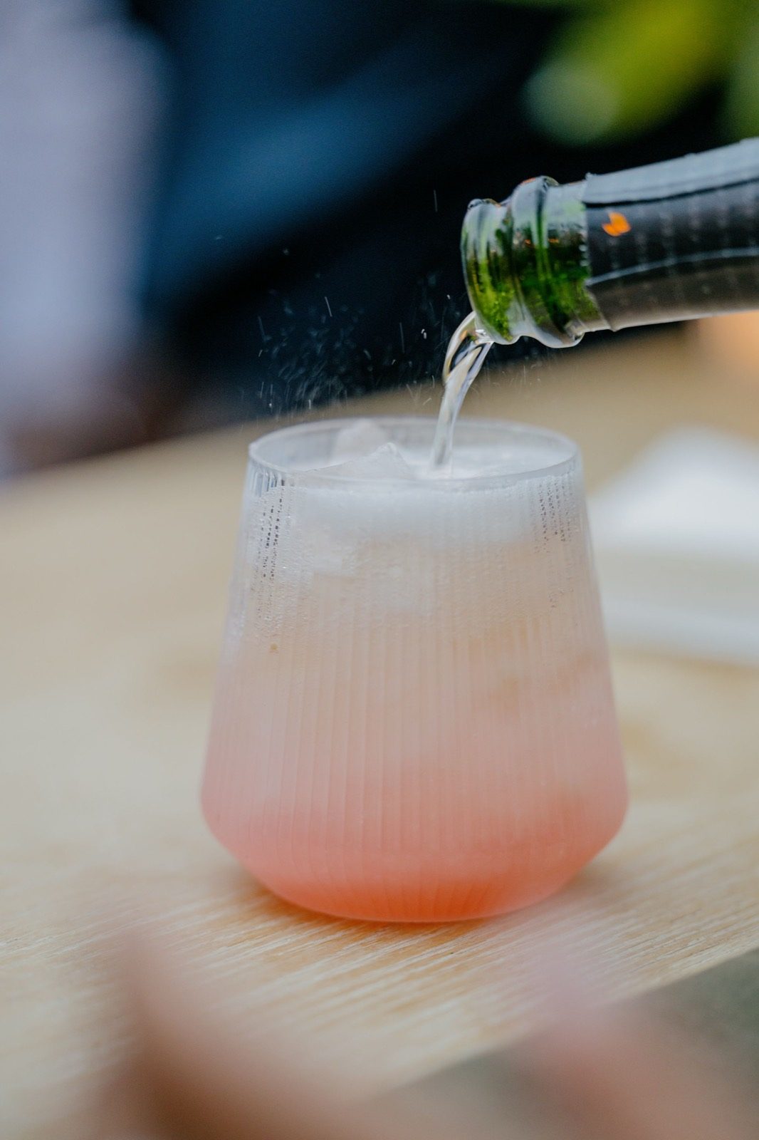 A cocktail mid-pour at the garden bar