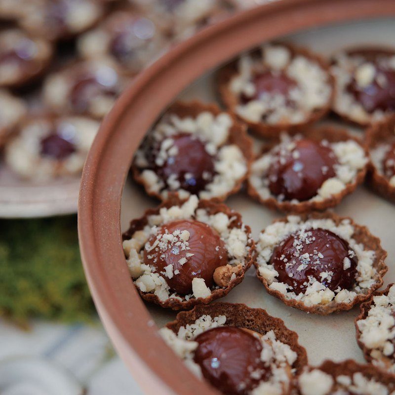 Foie gras tartlets with Michigan cherry gelée and crushed hazelnuts